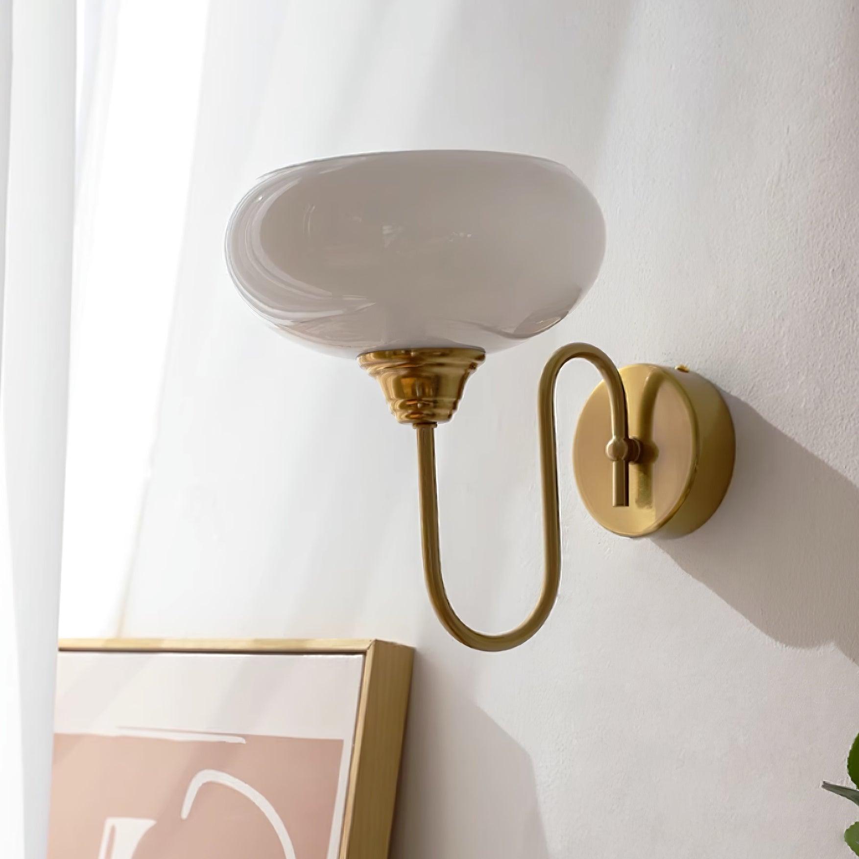 Clérachic glass wall lamp, copper and white glass, hardwired beside a sheer curtain and a gold picture frame.