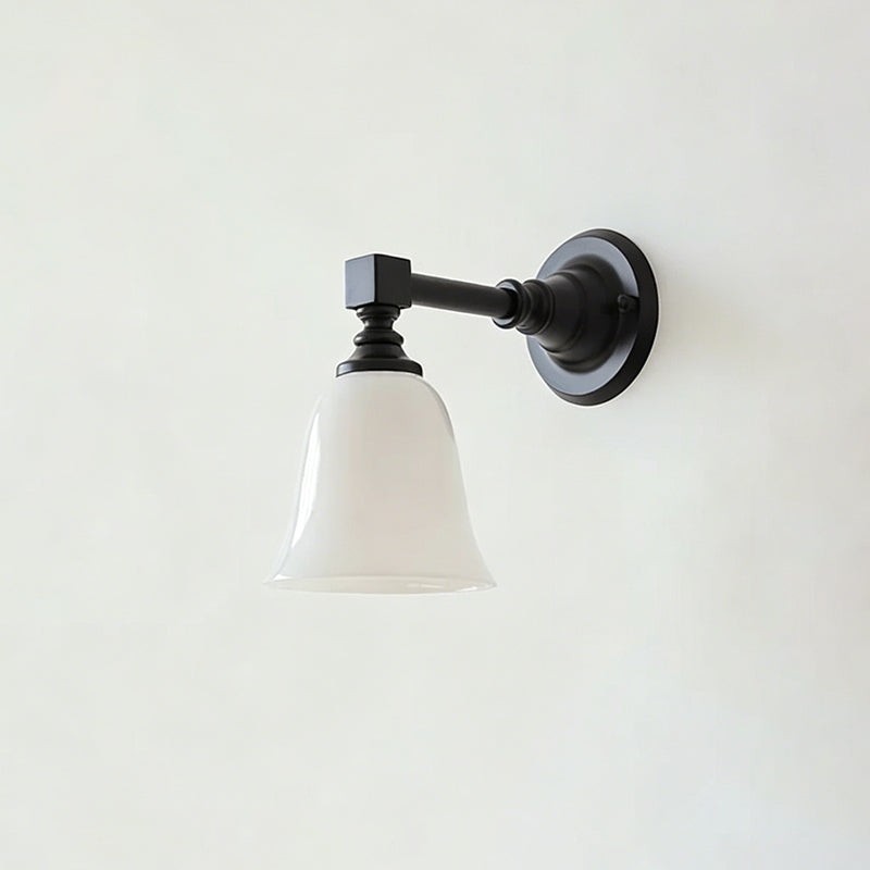 Black Clérachic wall light with a flared bell-shaped white glass shade, switched off, mounted on a pale grey wall.