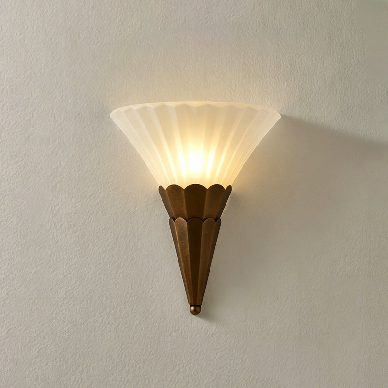 Lit single-cone Clérachic wall sconce, ribbed white glass above a tapered brown base with a small finial.