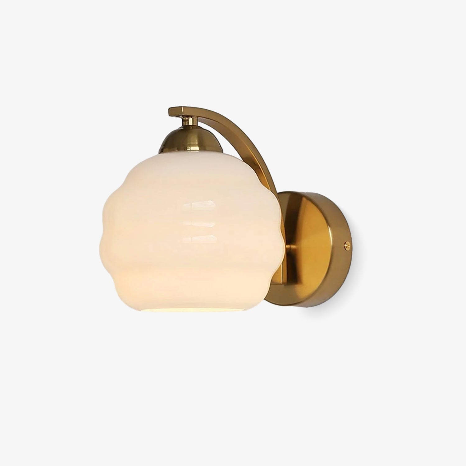 Clérachic gold wall sconce lit from within, the white lantern shade glowing warm against a pale studio wall.