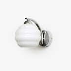 Angled studio shot of the Clérachic chrome wall sconce and white ribbed lantern shade, unlit on white.