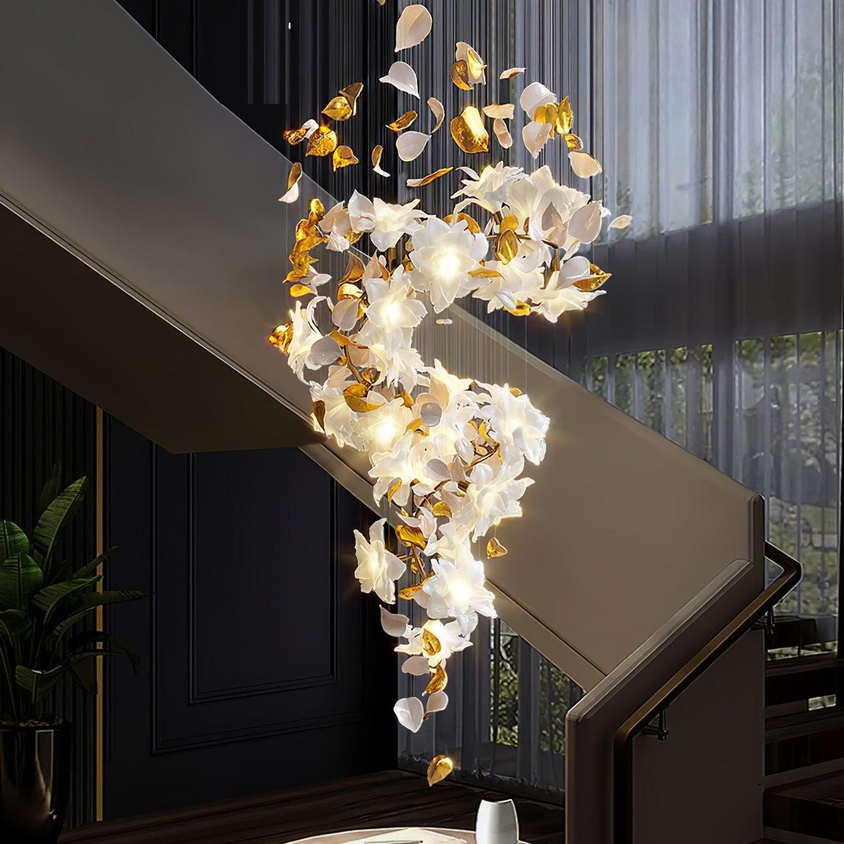 Hung down a stairwell with a dark wall and sheer curtains behind, this Clérachic chandelier glows in a long, twisting spiral of petals.