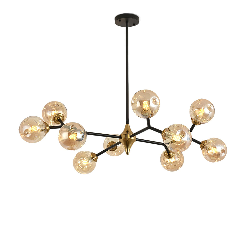 Black-and-gold branched frame of this Clérachic chandelier, set with amber glass globes, against a plain white backdrop.