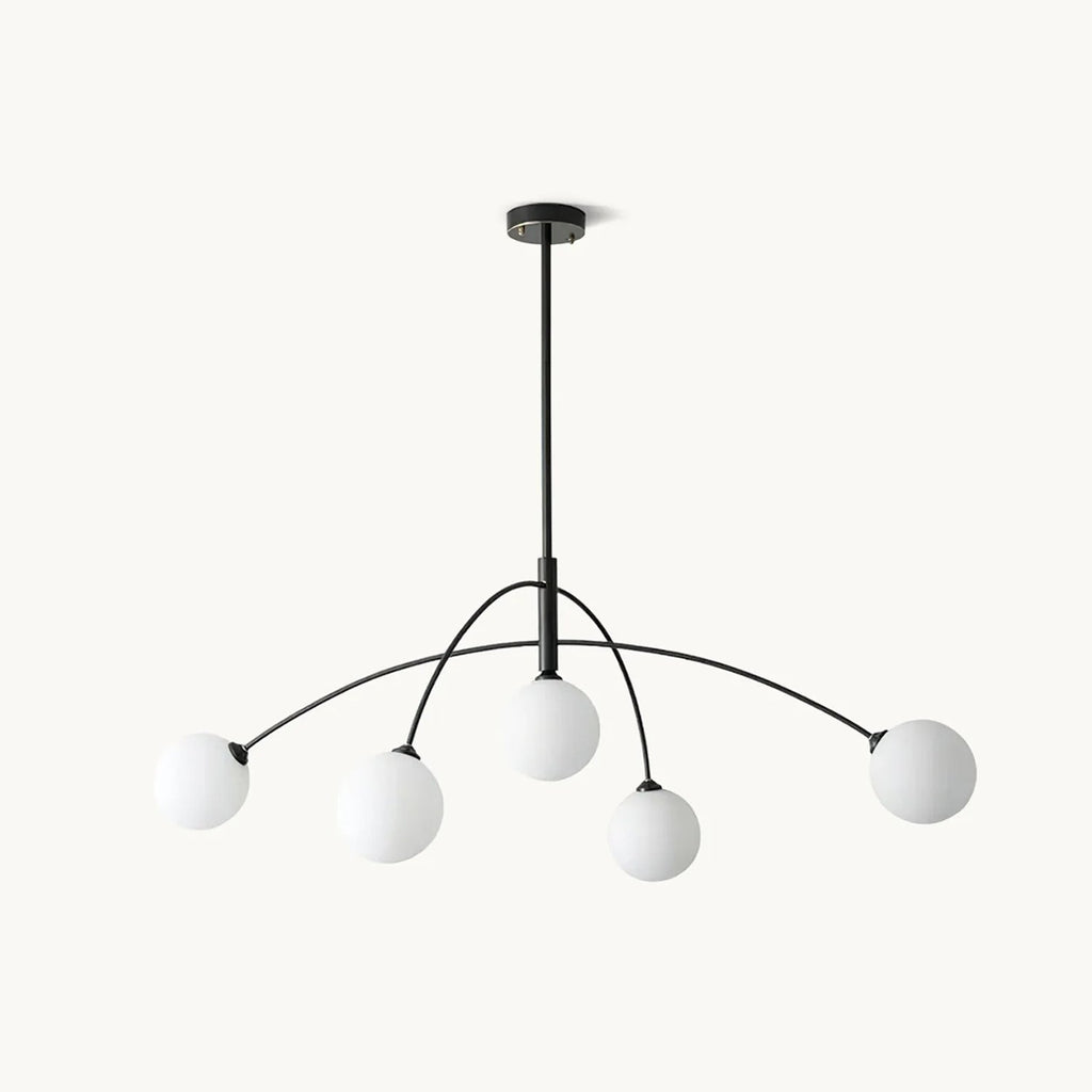 Clérachic five-globe chandelier with a black stem and curved black arms, each carrying a frosted white glass globe, on a plain white backdrop.