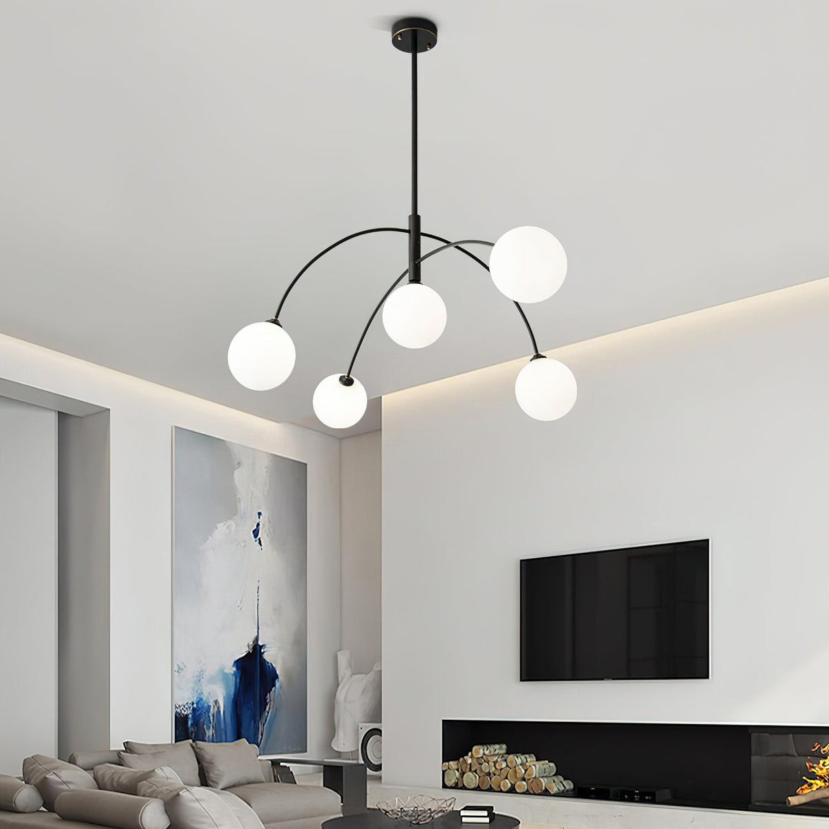 Black and white Clérachic chandelier in a lounge with a TV on the wall, a log-filled fireplace and a blue abstract canvas.