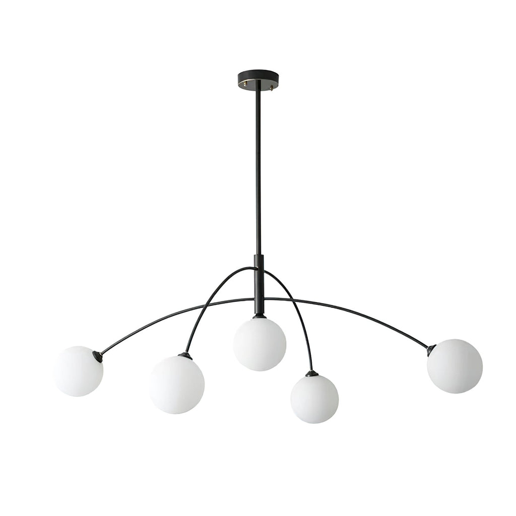 Black and white Clérachic chandelier on a white background, with five globes hanging below the swept black arms.