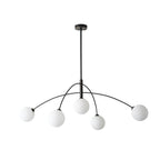 Black and white Clérachic chandelier on a pale background, with the arms curved over to hold five lit globes.