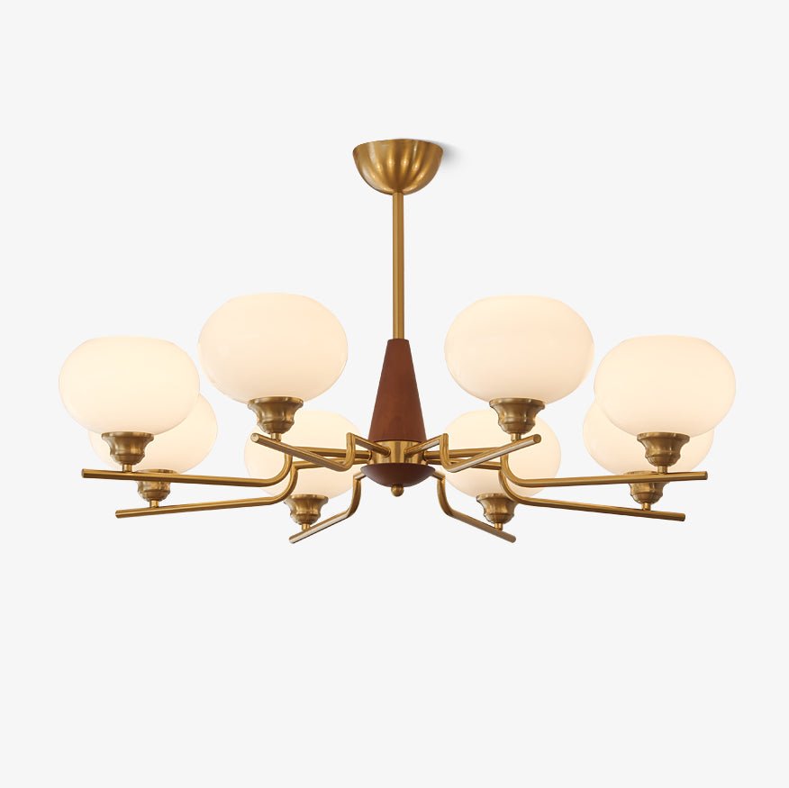 This Clérachic chandelier has frosted white globes on brass arms around a walnut cone and brass rod, on a plain white backdrop.