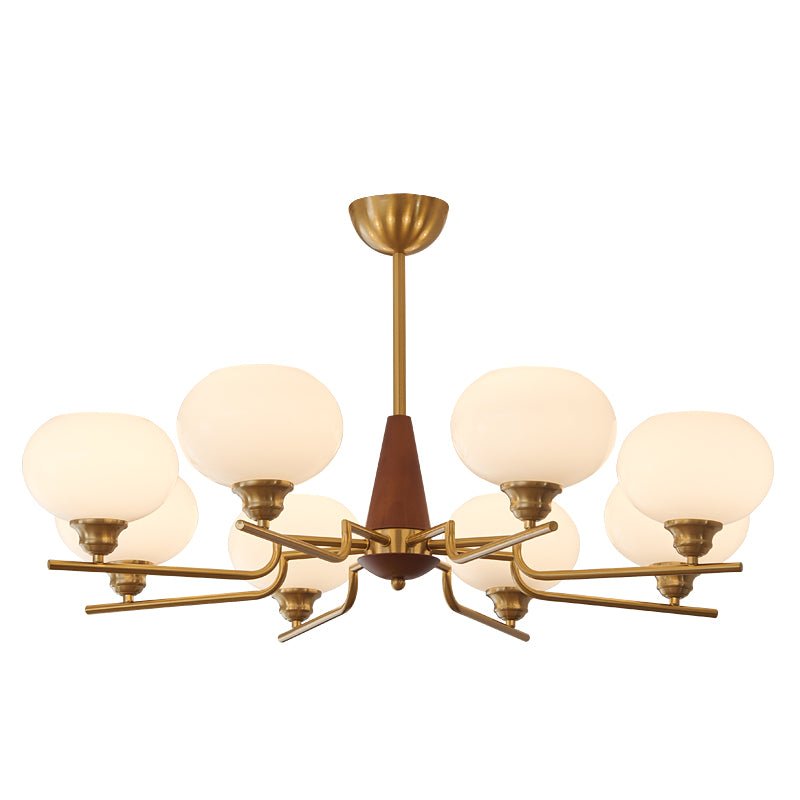 This Clérachic chandelier has eight globes on brass arms around a walnut cone, shown lit on a white backdrop.