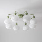 Unlit eight-globe Clérachic ceiling light in green, with two tiers of ribbed white globes on thin curved arms.