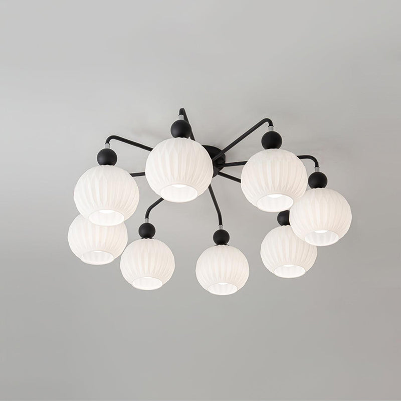 Eight-globe Clérachic ceiling light with black arms and balls, the ribbed white shades arranged in two rings.
