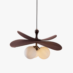 Front view of this Clérachic pendant on a white backdrop, with coffee-brown fabric petals over three opal glass globes on a brass stem.