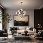 Smoked-glass Clérachic chandelier above a stone coffee table and cream sofa, in a room with a dark abstract painting.