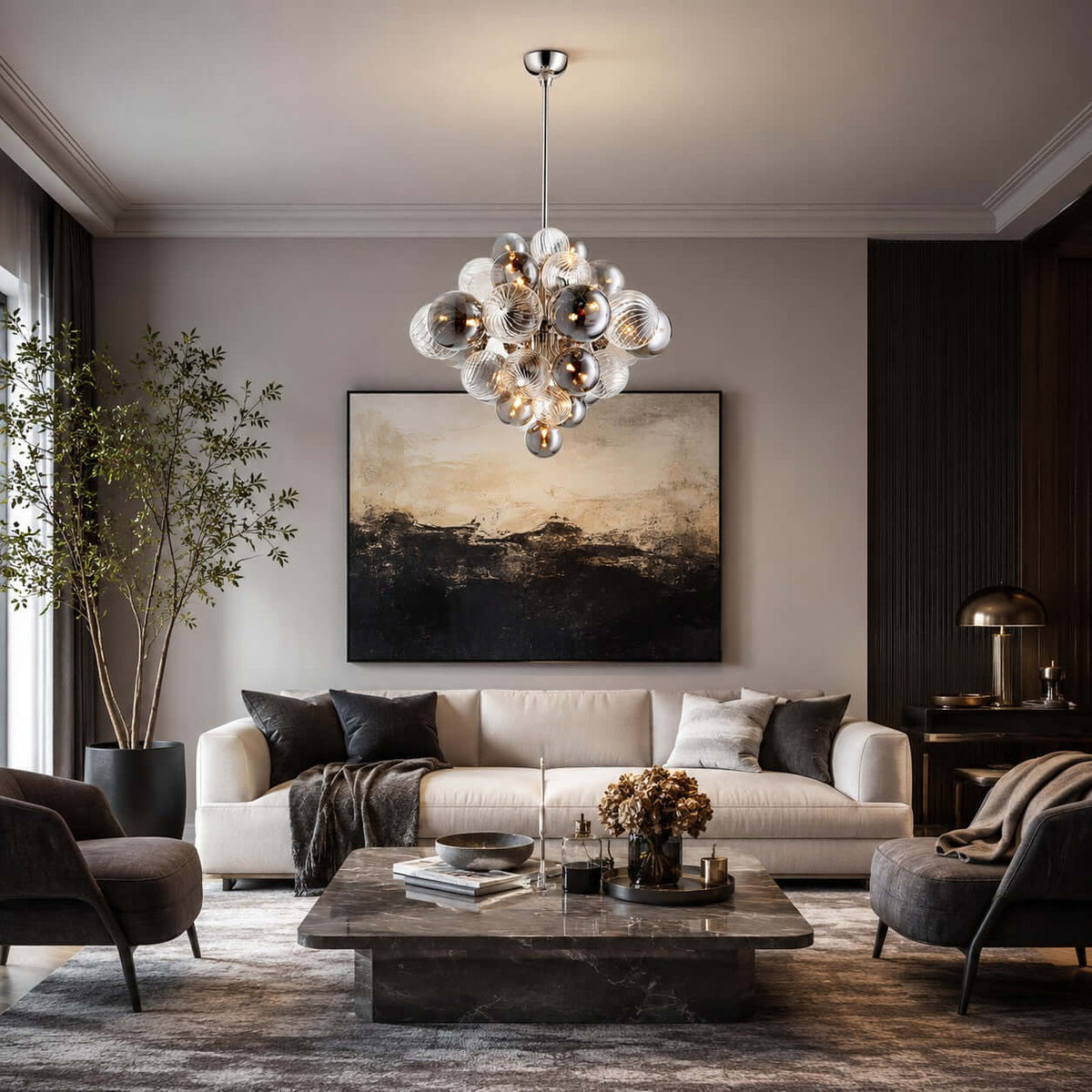 Smoked-glass Clérachic chandelier above a stone coffee table and cream sofa, in a room with a dark abstract painting.