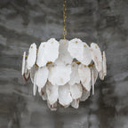 Clérachic Gloire alabaster chandelier seen from slightly below, the slim brass rods that carry each stone plate on show.
