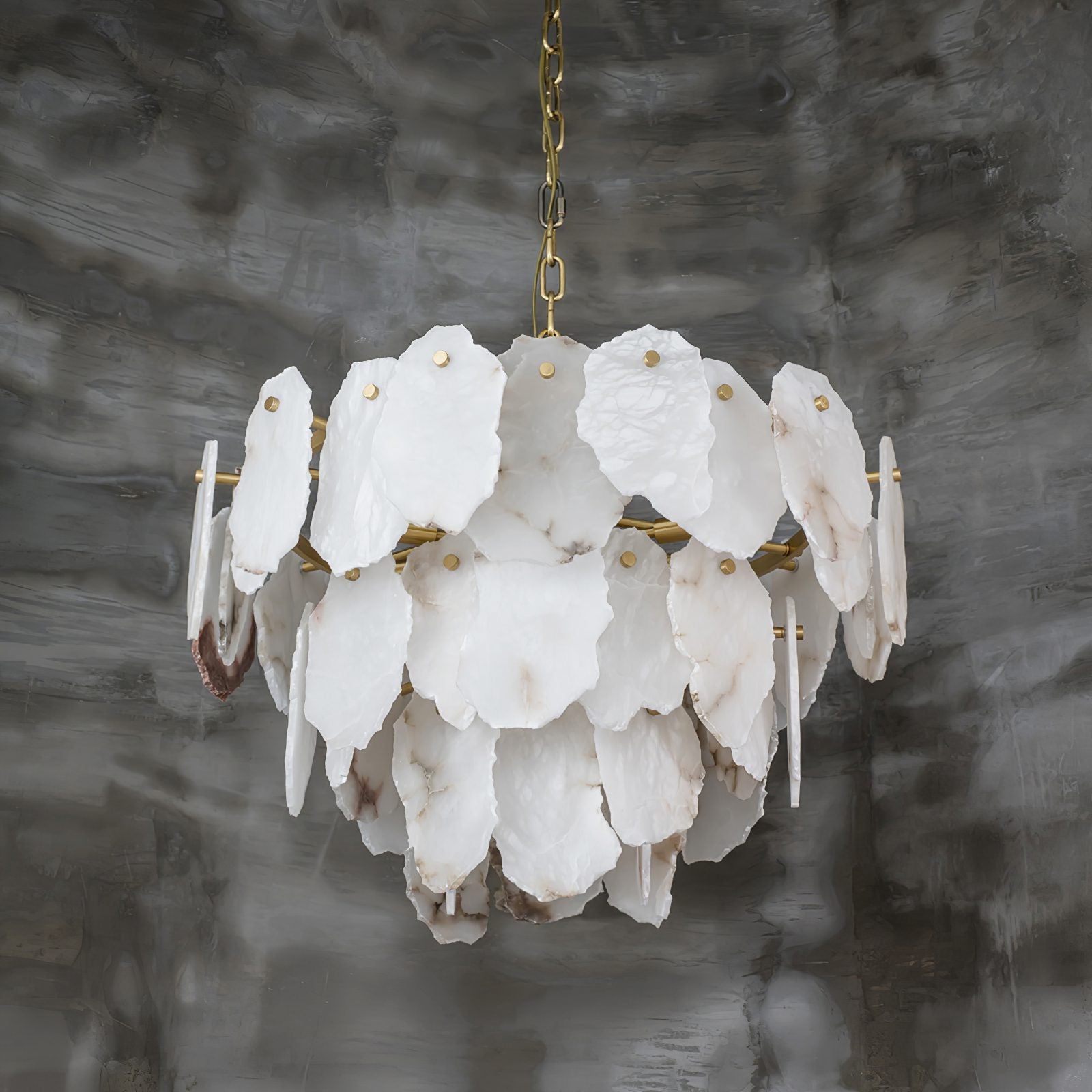 Clérachic Gloire alabaster chandelier seen from slightly below, the slim brass rods that carry each stone plate on show.