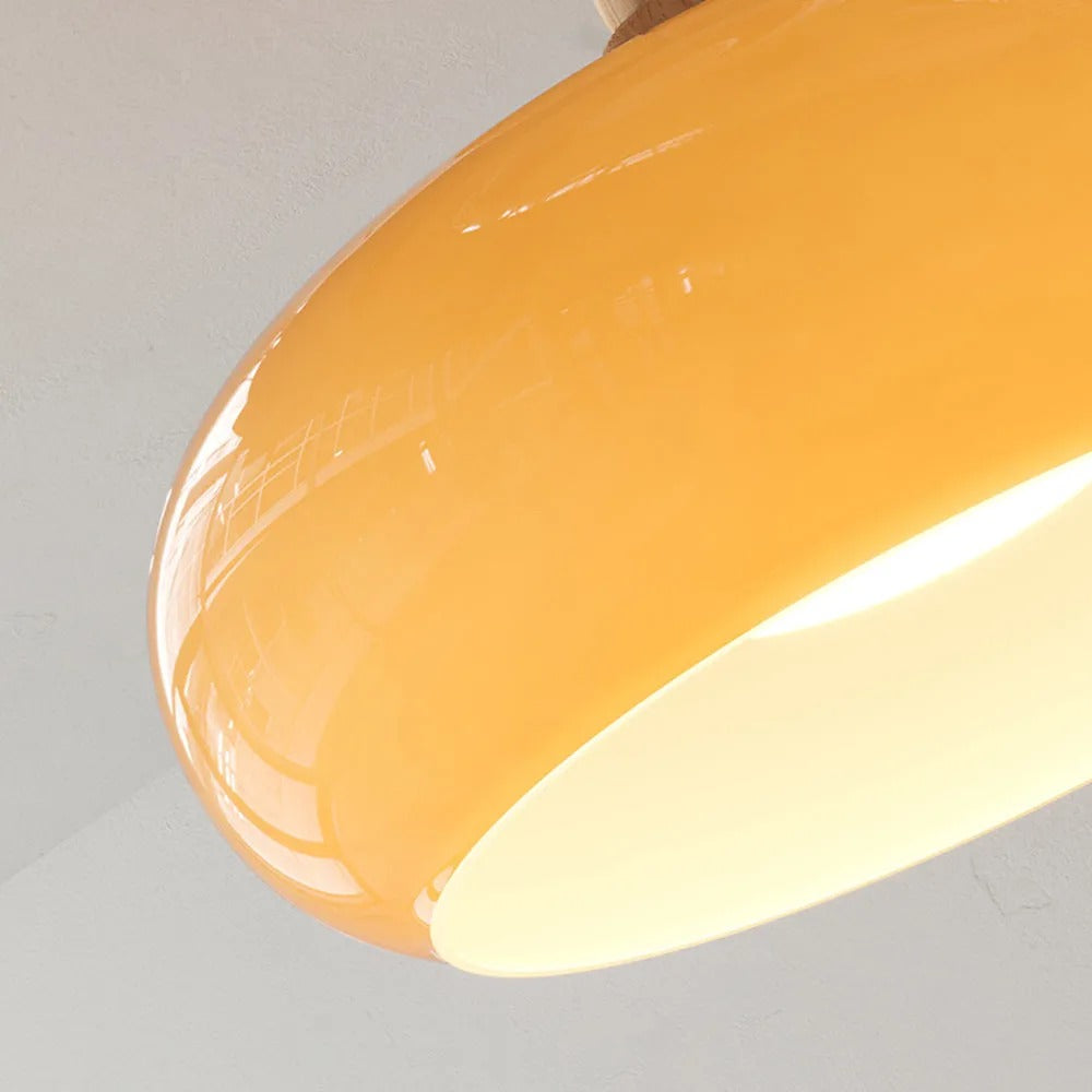 Underside close-up of the Clérachic orange dome, showing the open recessed disc washing light downward.