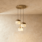 Clérachic alabaster pendant light in the 3-light cluster, unlit, three stone drum shades grouped under one canopy.