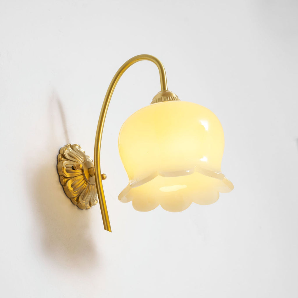 Clérachic wall light lit from a slightly different angle, showing the brass back plate and the frilled shade rim.