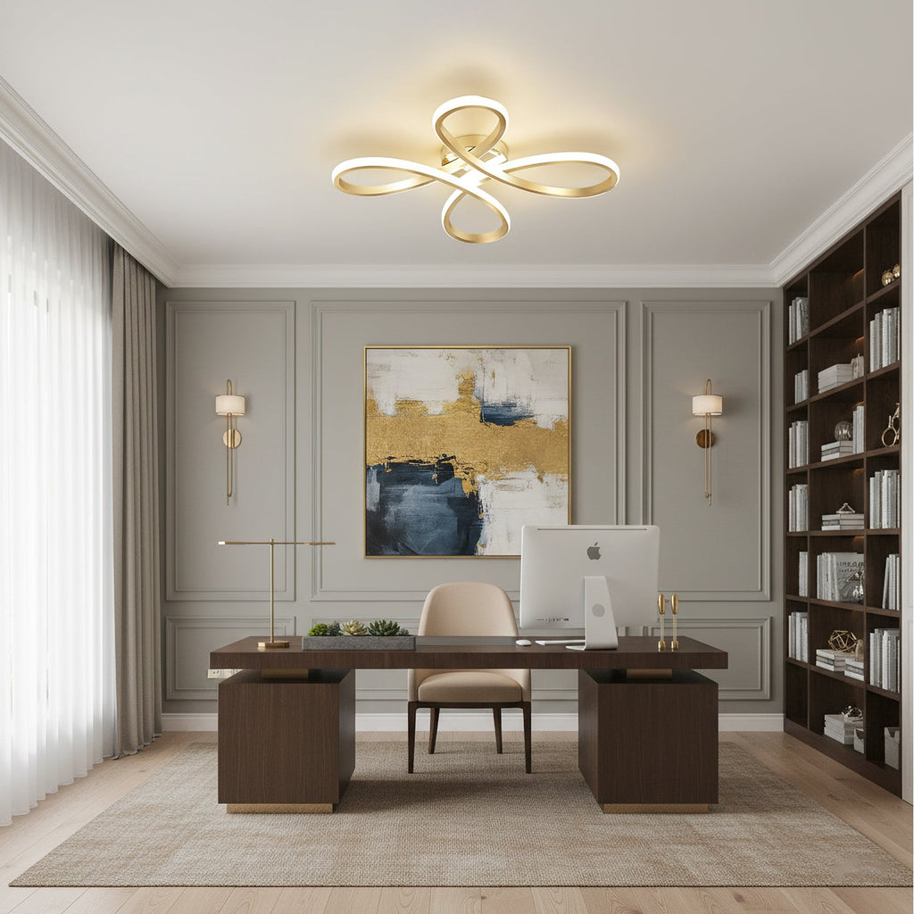 The Clérachic gold ceiling light above a dark wooden executive desk, with a gold-and-blue canvas and a tall bookcase behind.
