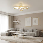 Clérachic ceiling light lit above a light grey corner sofa, with a marble coffee table and two framed prints on a taupe wall.