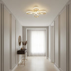 Clérachic ceiling light lit in a long, panelled hallway, with a narrow console table and a pale window at the far end.