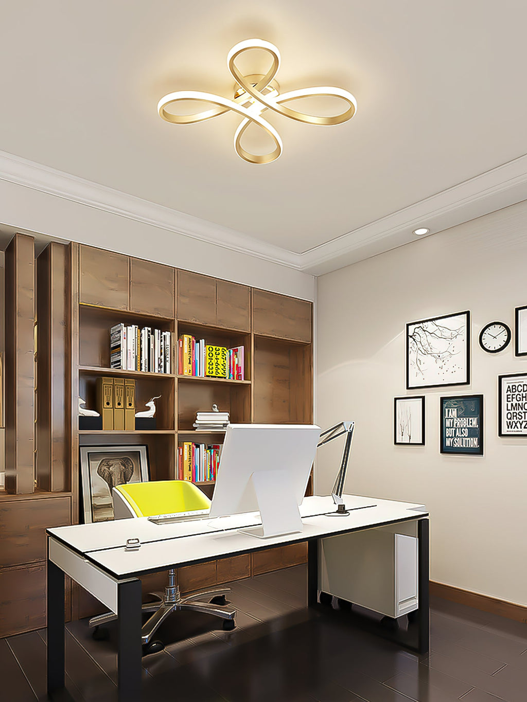 Clérachic ceiling light over a home office with a white desk, a wooden bookcase, a computer and framed black-and-white prints.