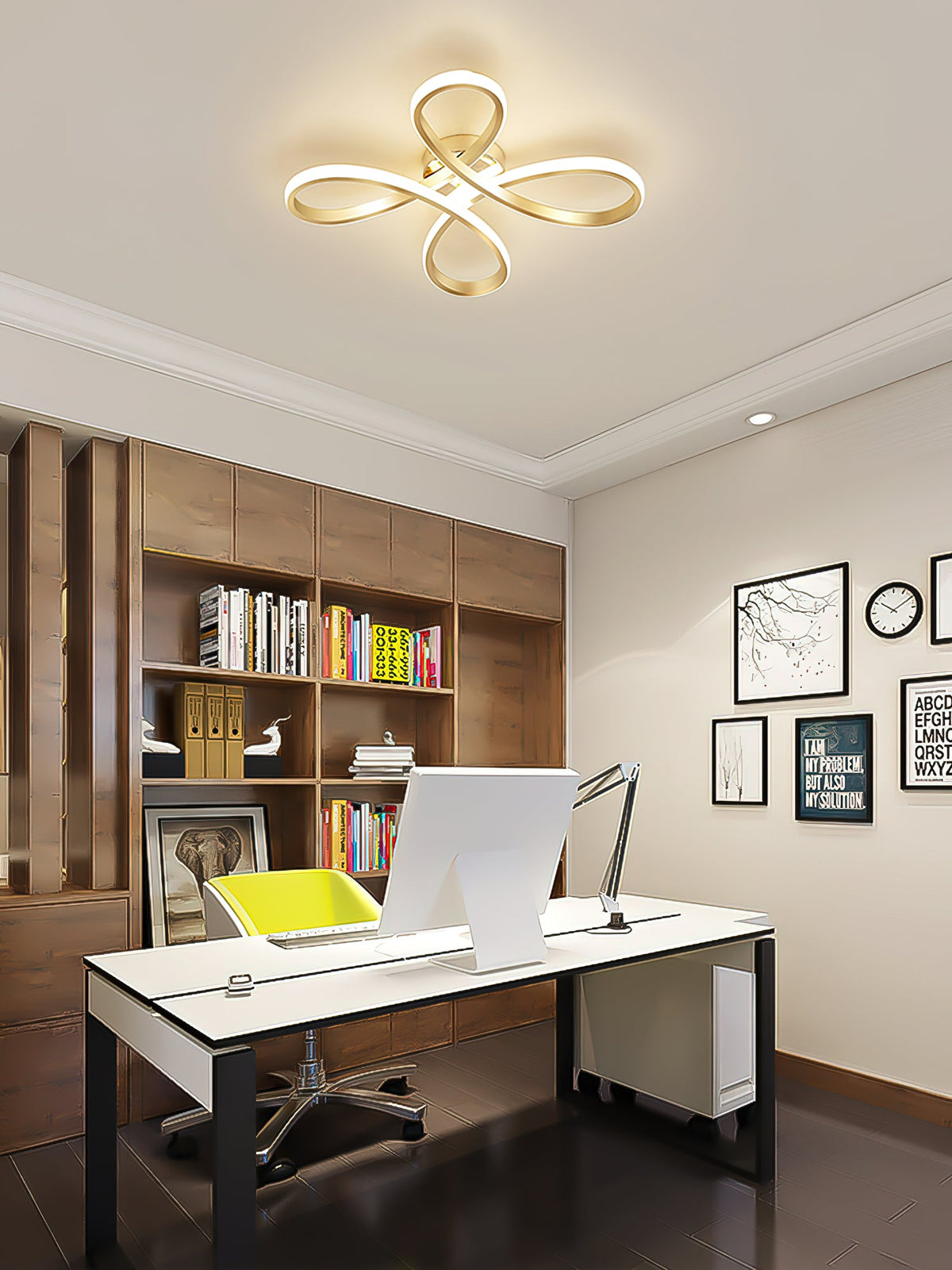 Clérachic ceiling light over a home office with a white desk, a wooden bookcase, a computer and framed black-and-white prints.