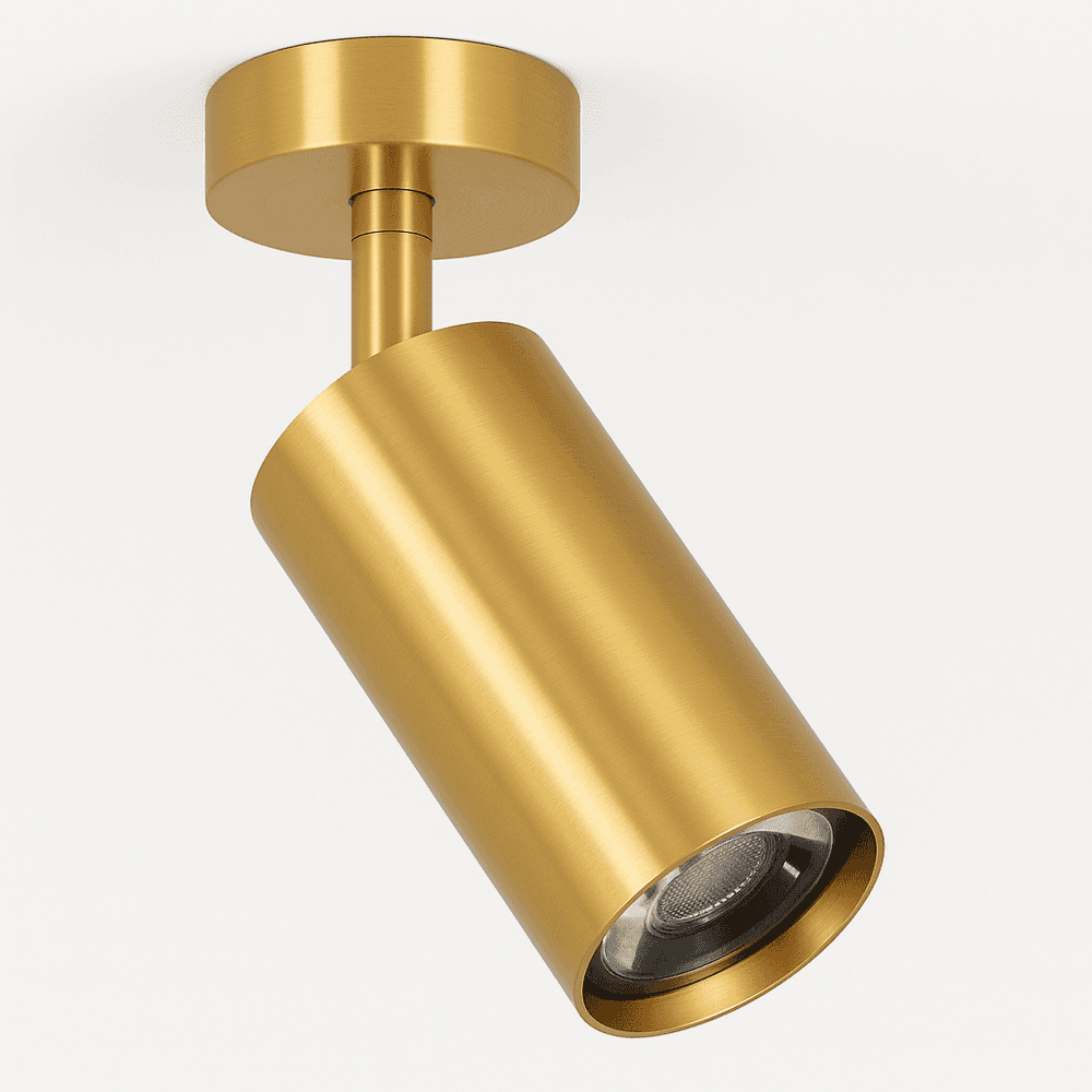 Clérachic gold ceiling spotlight on a short stem, a gold cylinder head angled on a round canopy, shown on white.