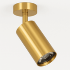Clérachic gold ceiling spotlight on a short stem, a gold cylinder head angled on a round canopy, shown on white.