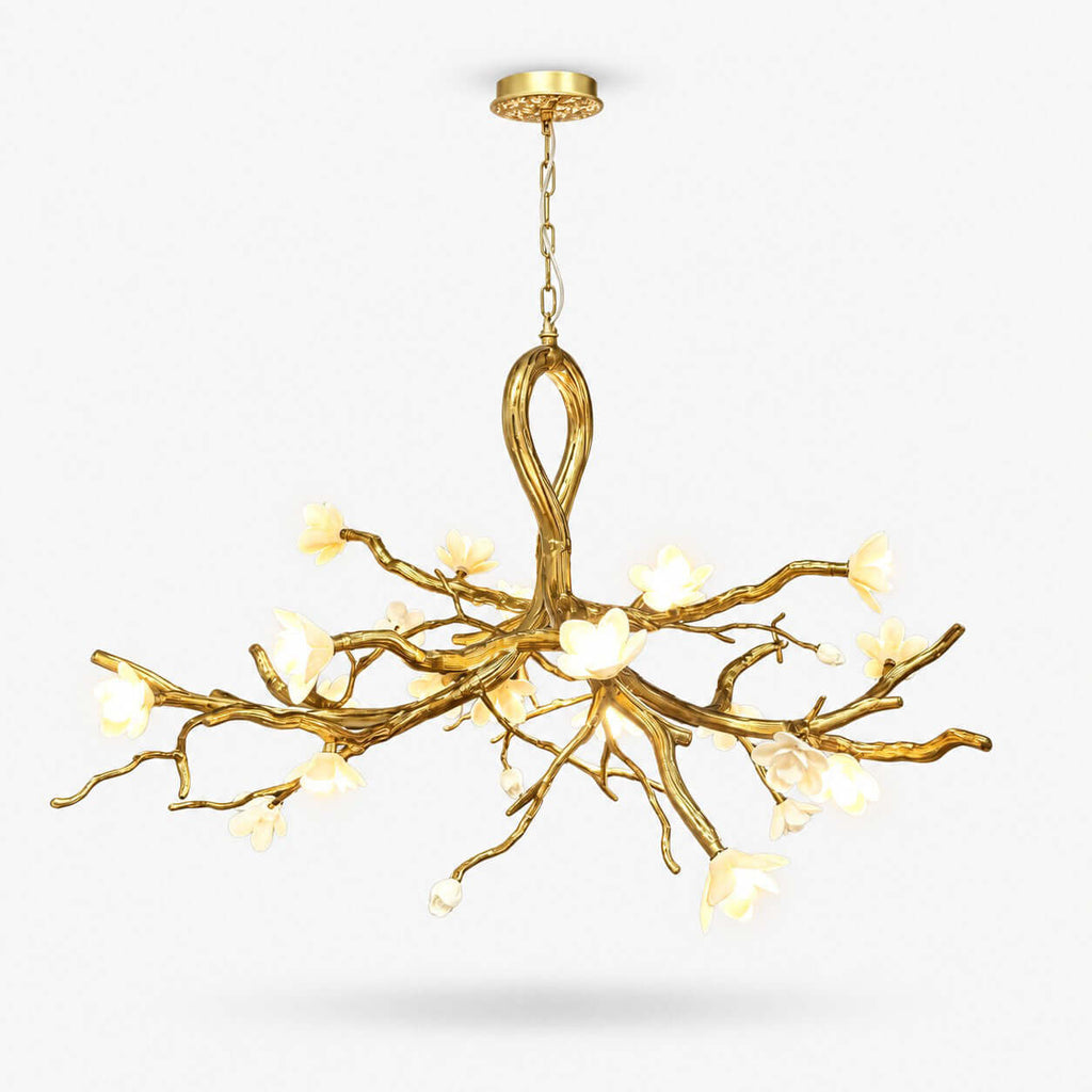 A Clérachic chandelier with gold metal branch arms rising from a looped centre and lit ceramic blossoms, shown on a plain white backdrop.