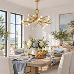 This Clérachic chandelier lit over a wooden table set with blue hydrangeas, lemons and croissants, with a sea view through the window.