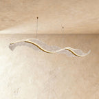 Clérachic's undulating chandelier forms a graceful double curve, hung from two slim ceiling cables.