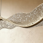 Close-up of the Clérachic chandelier's mosaic-textured acrylic shows a crackled, stone-like surface.
