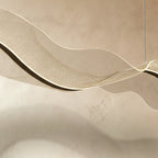 This close view of the Clérachic wave chandelier reveals a fine speckled, starry-sky-like texture.