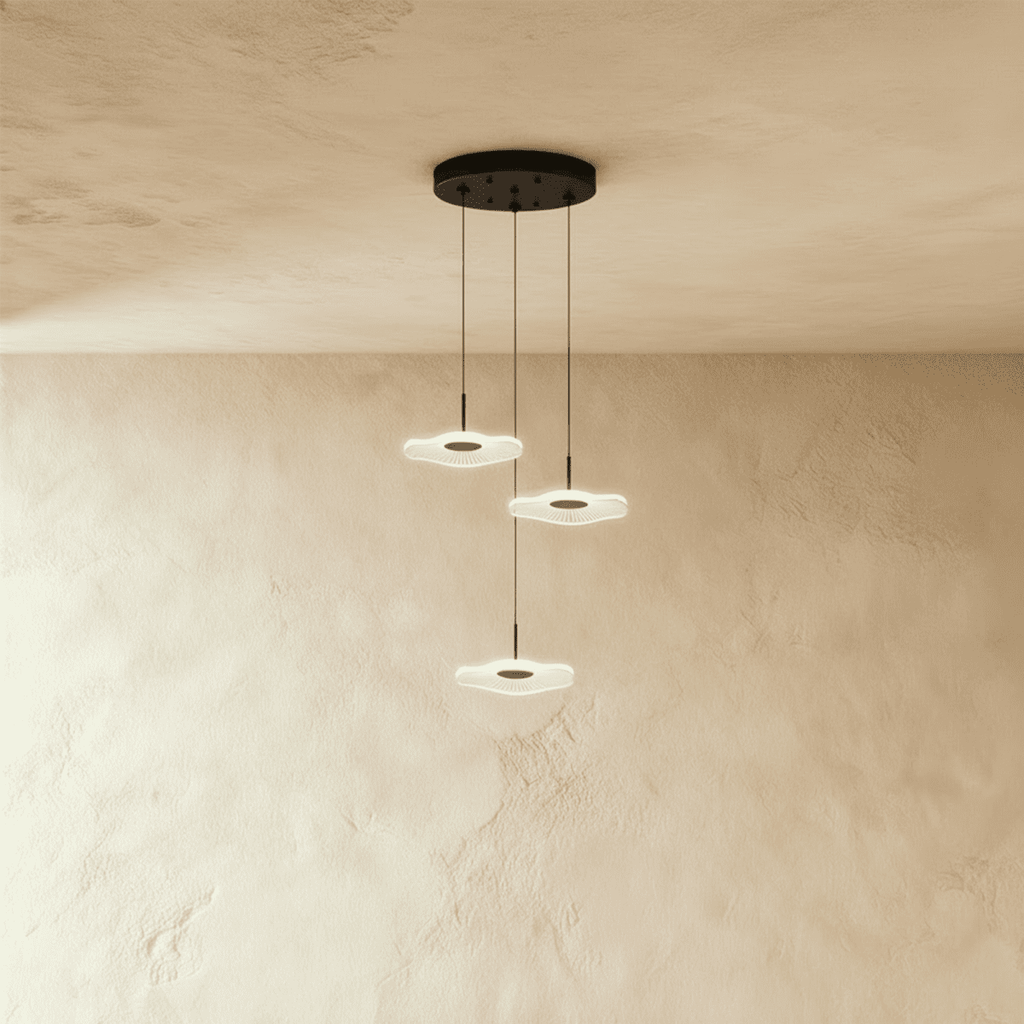Clérachic staircase chandelier in black, three flower-shaped LED discs cascading on cables from a round ceiling plate.