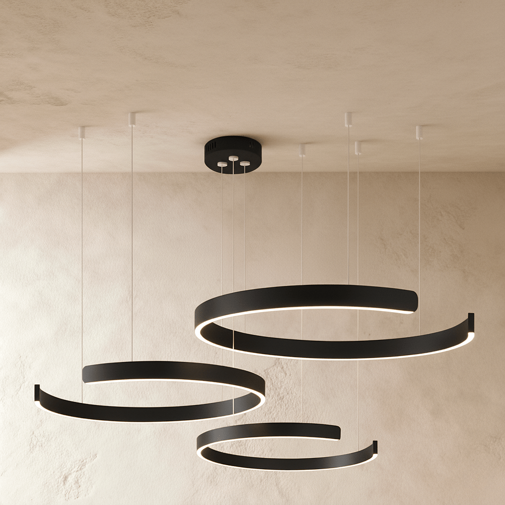 Clérachic's three-ring LED chandelier hangs in matte black, its round rings stacked at staggered heights.