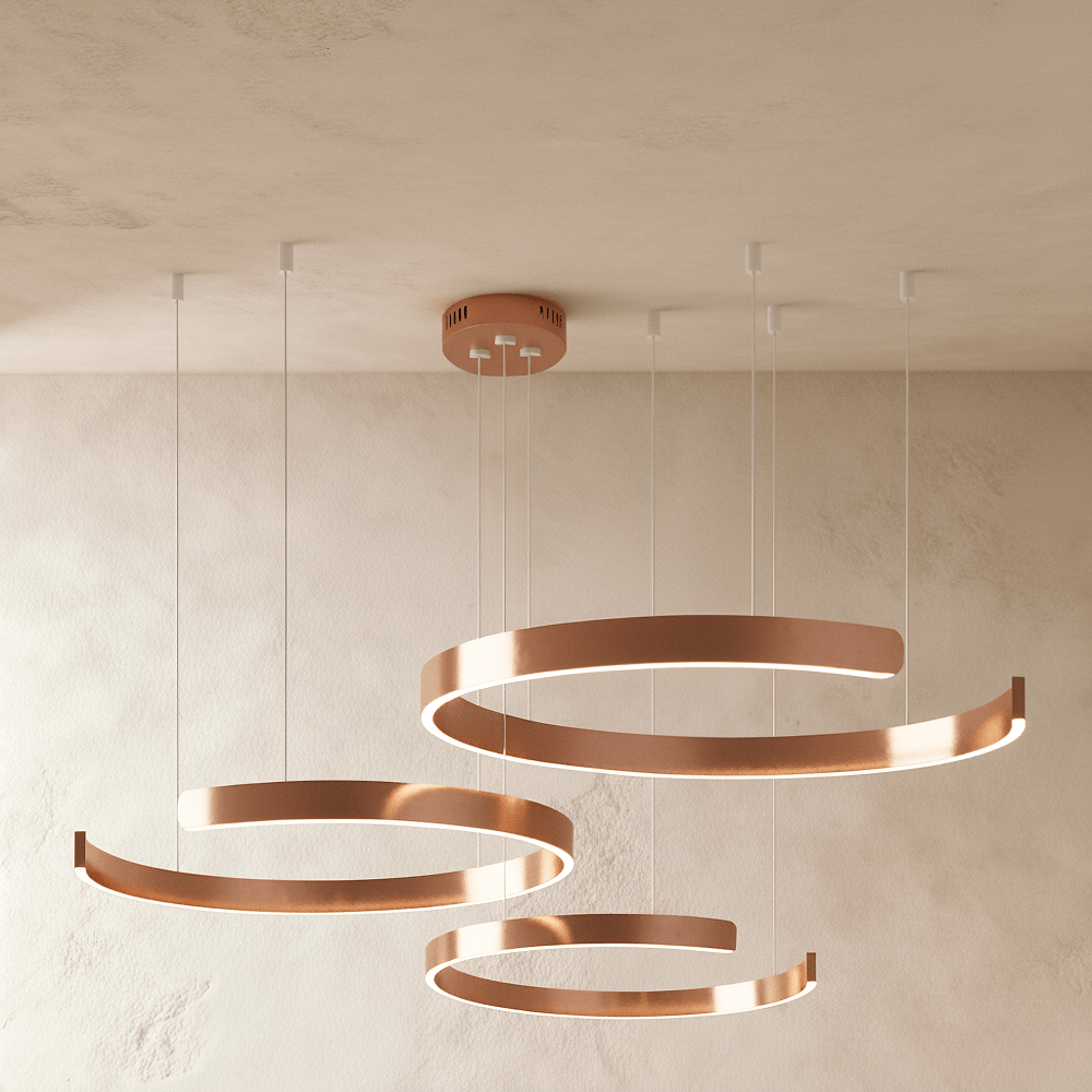 This Clérachic three-ring chandelier glows in a rose gold finish, its stacked rings hanging at three heights.