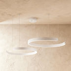 This Clérachic two-ring LED chandelier hangs in matte white, its stacked rings glowing softly from below.