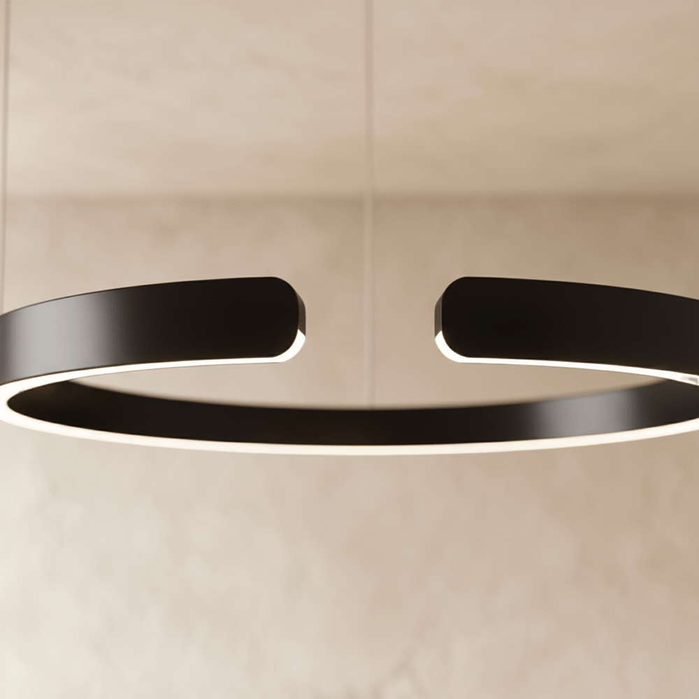 A close view of the Clérachic ring chandelier's matte black finish shows the gap where its ends meet.