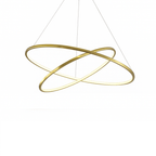 Clérachic gold two-ring LED chandelier lit with a warm glow along both crossed rings, shown on a plain white background.
