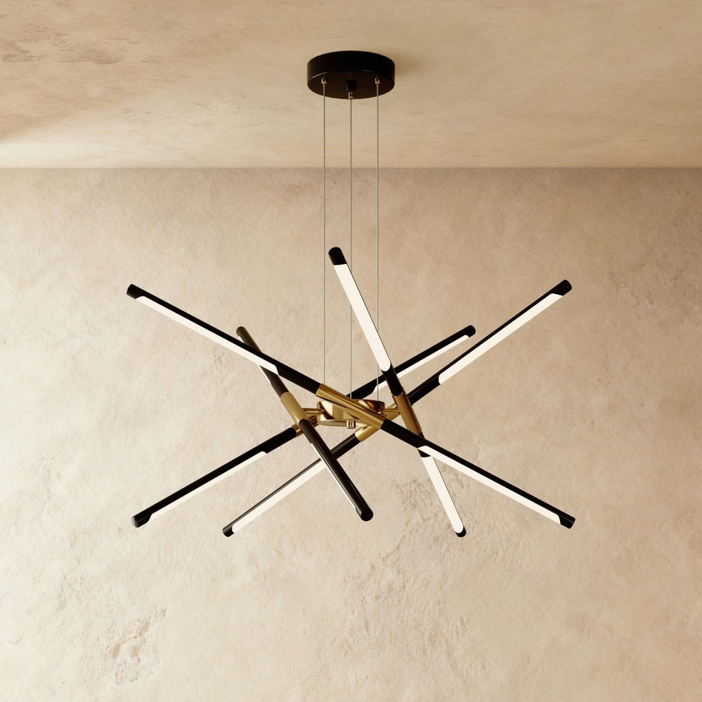 Clérachic ten-rod starburst chandelier in black and gold, slim LED rods crossing at varied angles from a central hub.