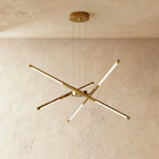 Clérachic six-rod chandelier in all-gold, with each slim LED rod angled out from a gold hub and ceiling plate.