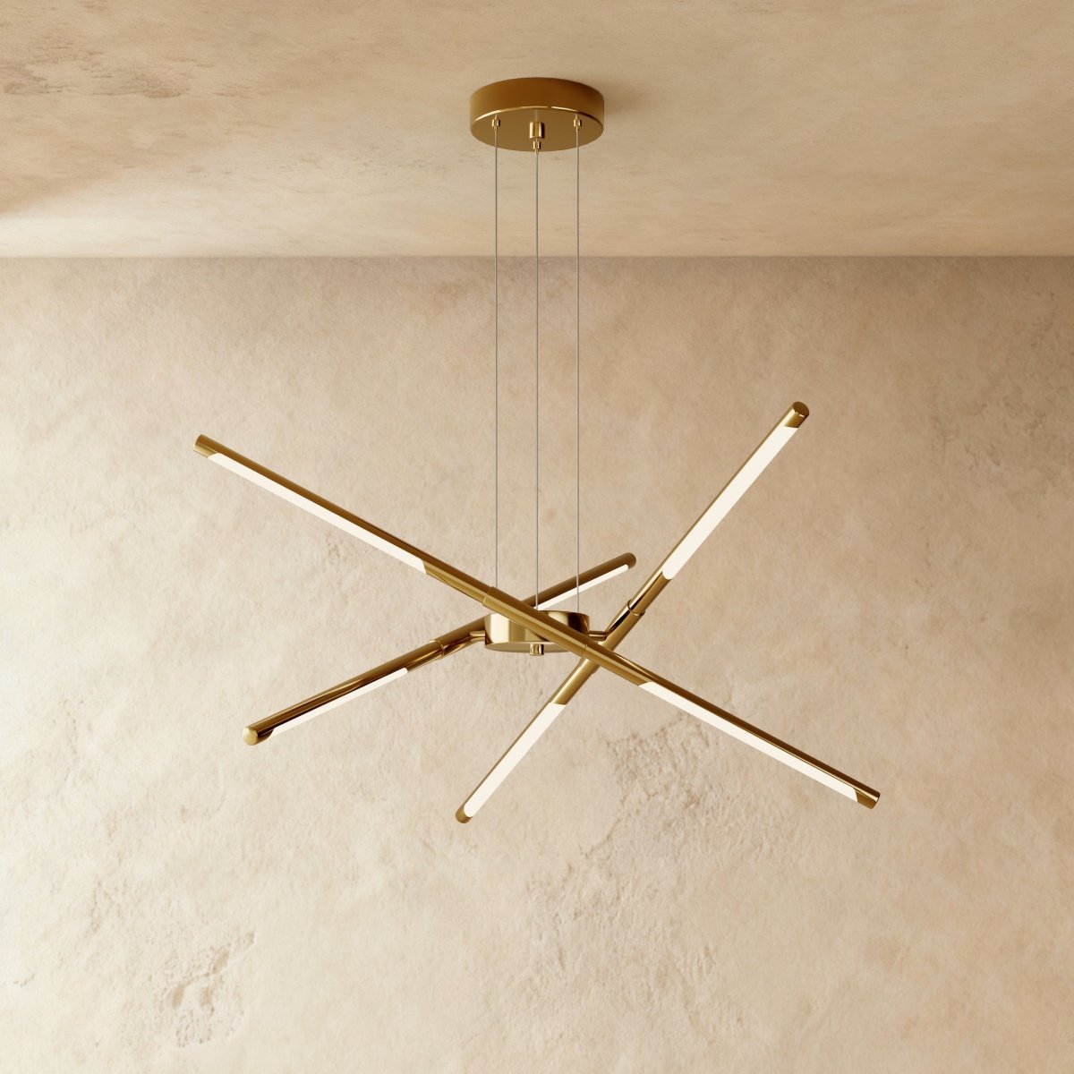 Clérachic six-rod chandelier in all-gold, with each slim LED rod angled out from a gold hub and ceiling plate.