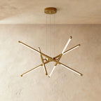Clérachic eight-rod starburst chandelier in all-gold, its rotatable LED rods spread at different angles.