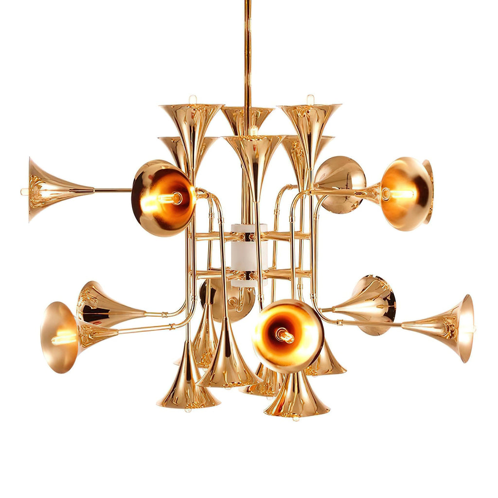 The gold trumpet heads and slim brass arms of this Clérachic chandelier, shown lit on a white backdrop from a low angle.
