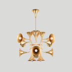 Smaller gold trumpet-head Clérachic chandelier on a plain light grey backdrop, hanging from a straight stem.