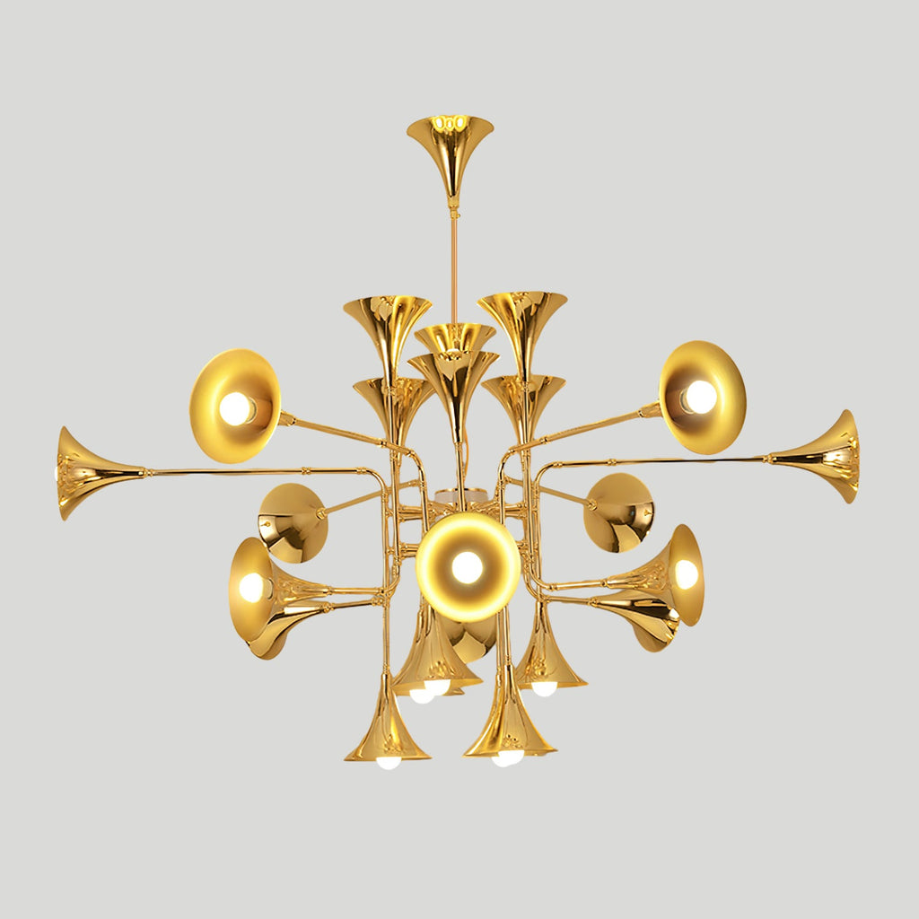 Wide gold Clérachic chandelier with trumpet heads on long side arms, photographed on a light grey backdrop.