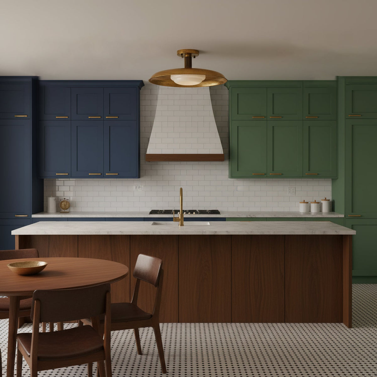 This Clérachic gold dish ceiling light hangs above a kitchen island, with navy and green cabinets and a white range hood.