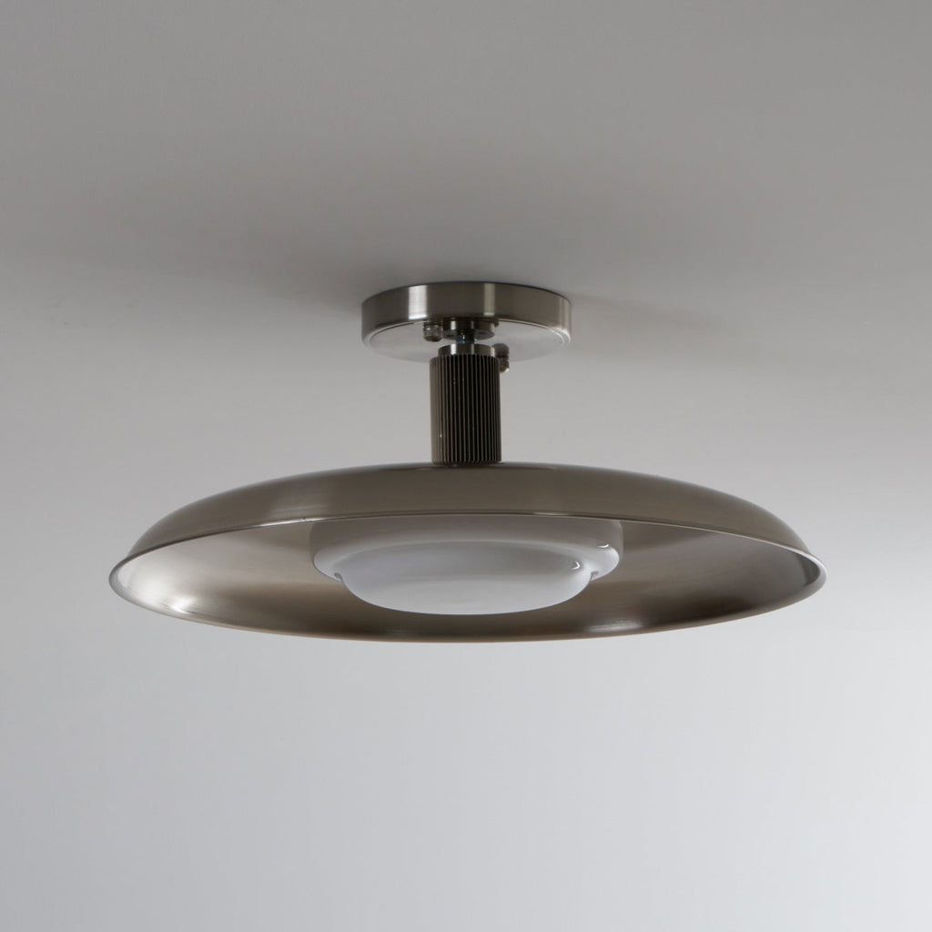 A Clérachic nickel ceiling light with its white diffuser unlit, showing the ribbed stem and brushed dish.